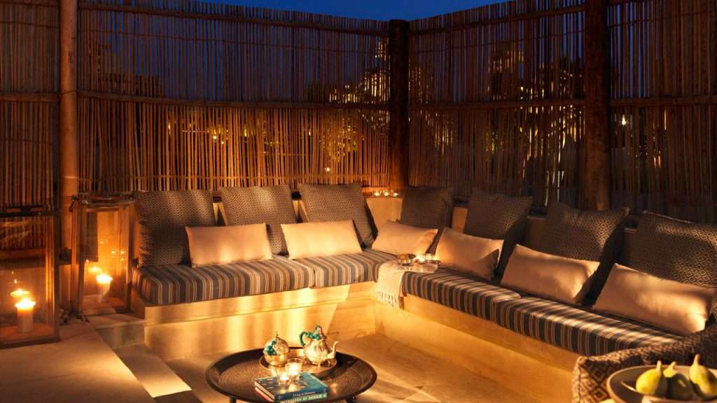 Outdoor sunken seating area with timber lath screens