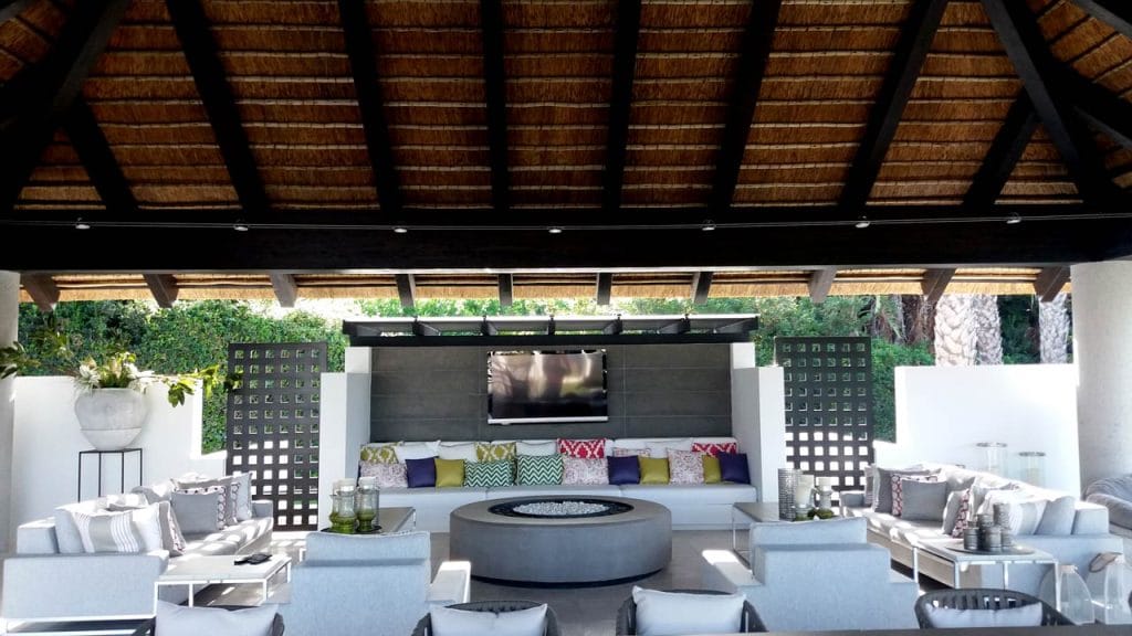 Thatched outdoor living space on square timber