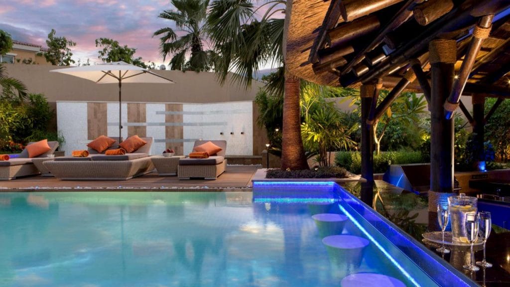 Enjoy the Serenity of a Thatched Gazebo with a Swim-up Pool Bar