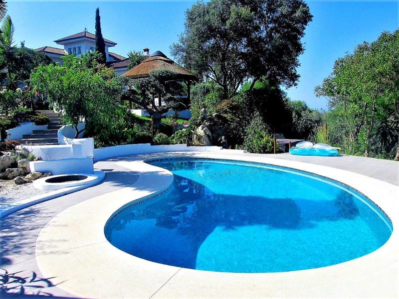 Katsura design poolside thatched gazebo in garden landscape