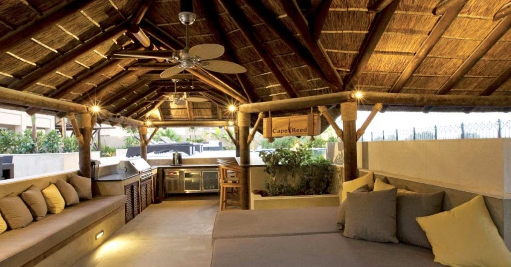 Customized thatched gazebo interior with kitchen