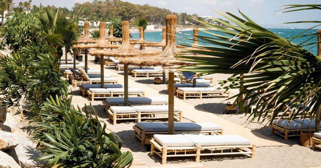 Thatch sombrilla with sun loungers