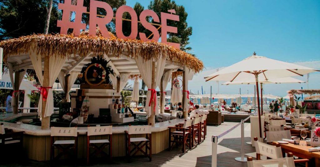 Cape Reed synthetic thatch Nikki Beach pool bar with timber decking