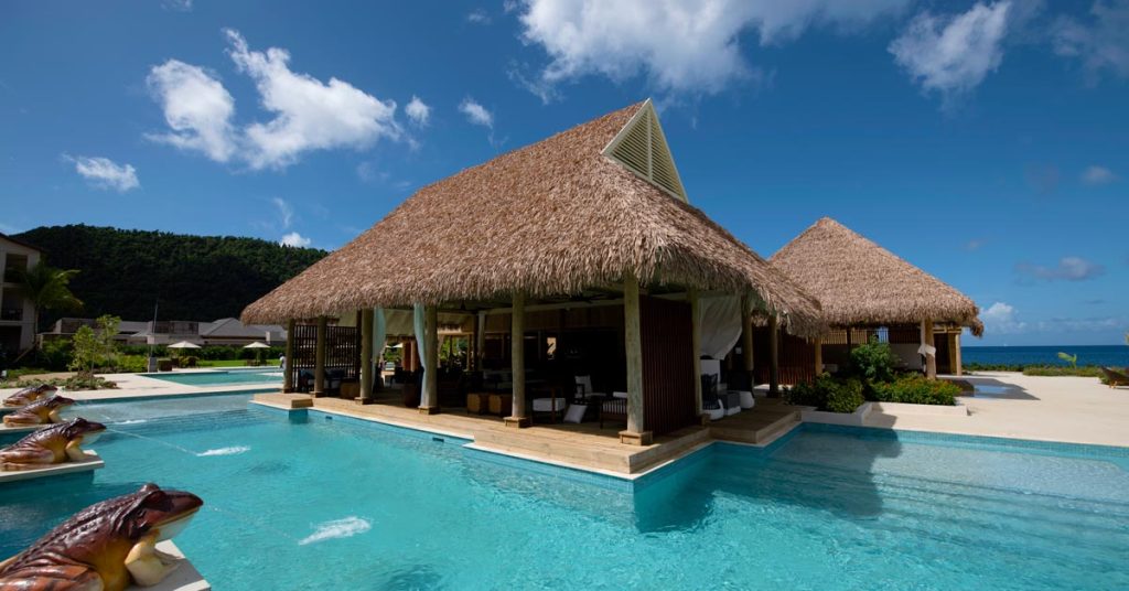 Cape Reed synthetic thatch roof Cabrits Resort Kempinski Dominica poolside villa with decking