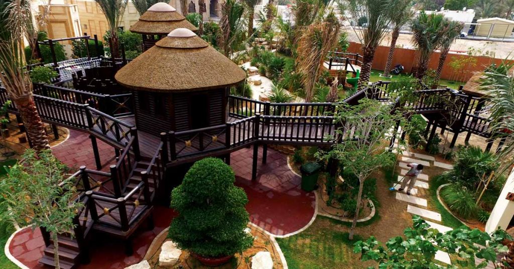 Cape Reed turnkey project timber and thatch playstructures with timber walkways