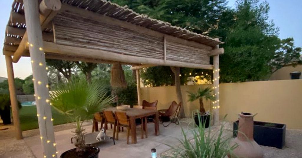 A beautifully crafted Cape Reed eucalyptus timber pergola with evenly spaced laths creating a picturesque outdoor space.