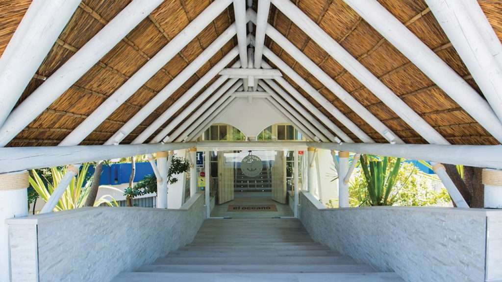 El Oceano beach restaurant white washed thatched roof entrance