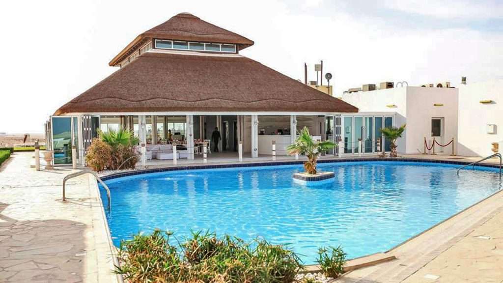 Royal World Island Beach Club in Dubai, showcasing its luxurious beachfront facilities and stunning architecture