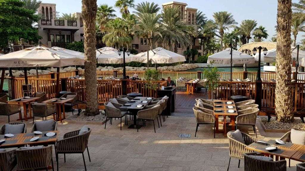 Restaurant timber seating area extension into water canal