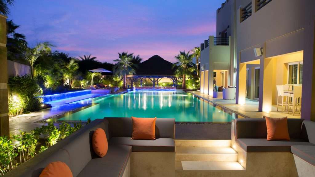 Sunken thatched gazebo with outdoor area