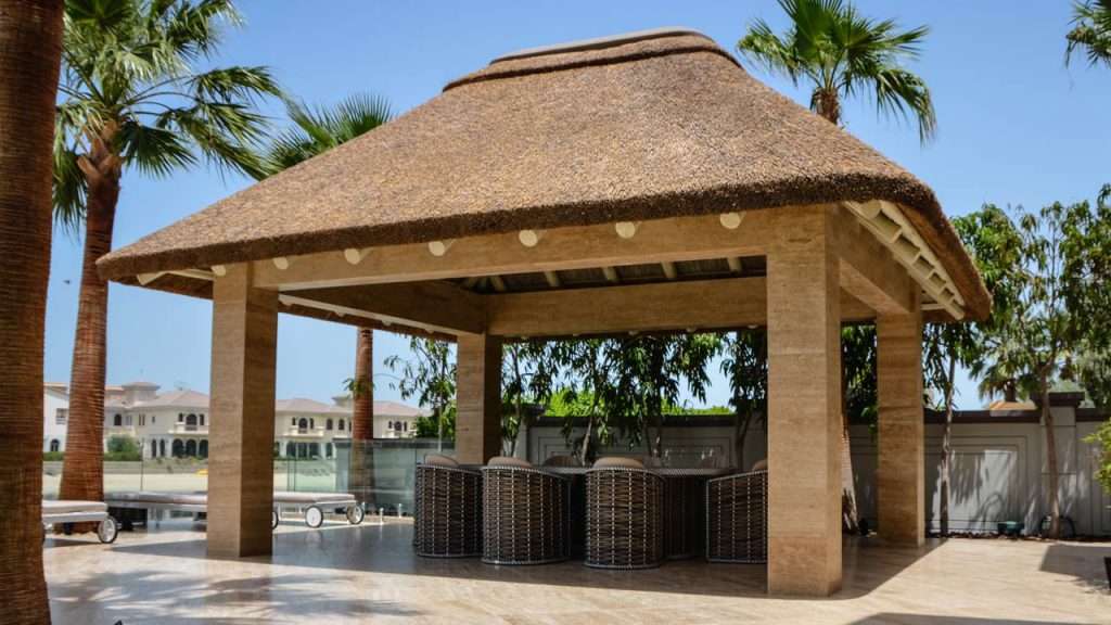 Thatched gazebo on concrete substructure