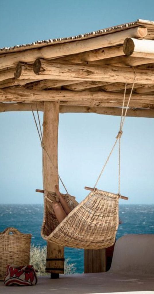 Rustic timber pergola with hammock