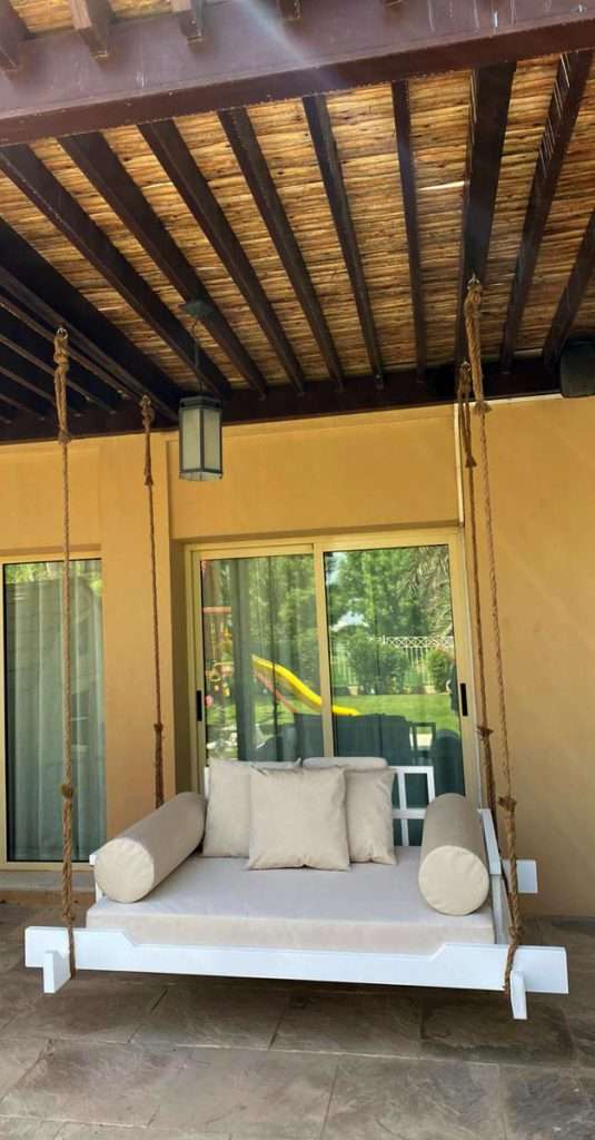 Timber pergola with swing bed