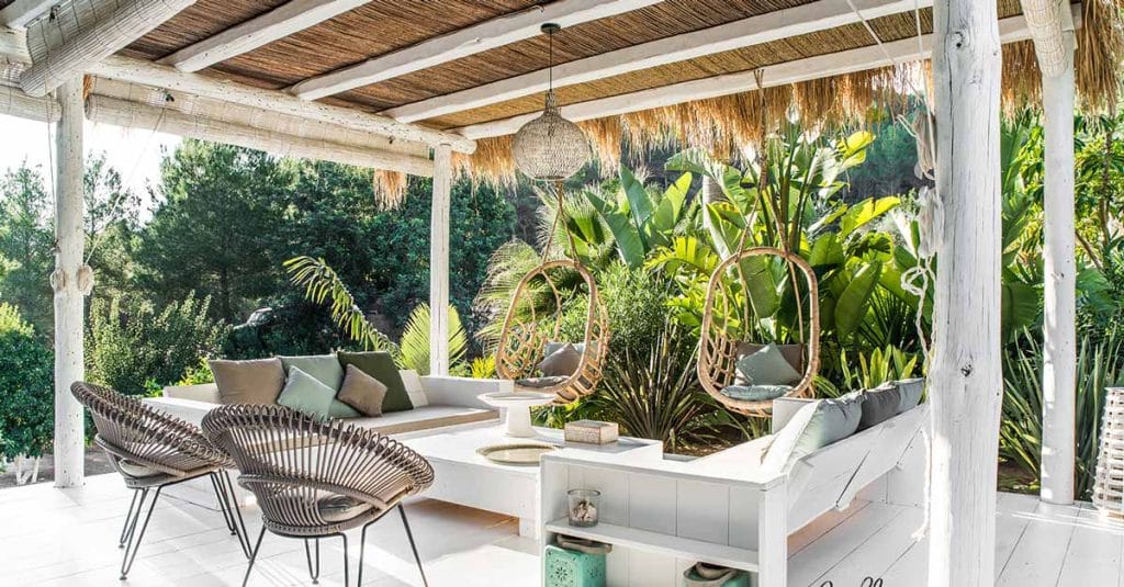 Whitewashed pergola with seating