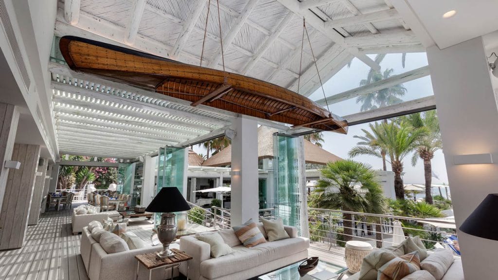 Wooden ceiling with rustic beams adding warmth and character to the interior space.