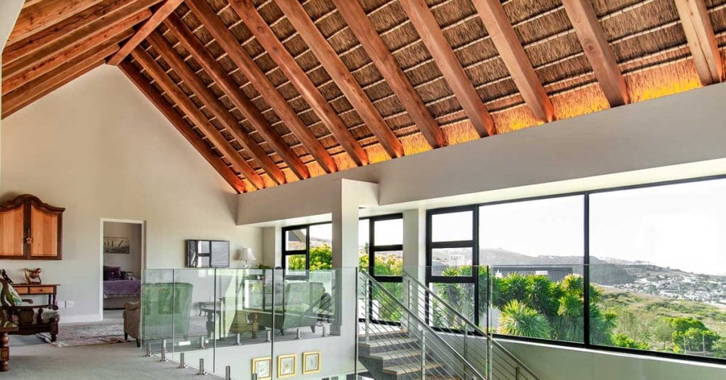 Wooden ceiling with rustic beams adding warmth and character to the interior space.