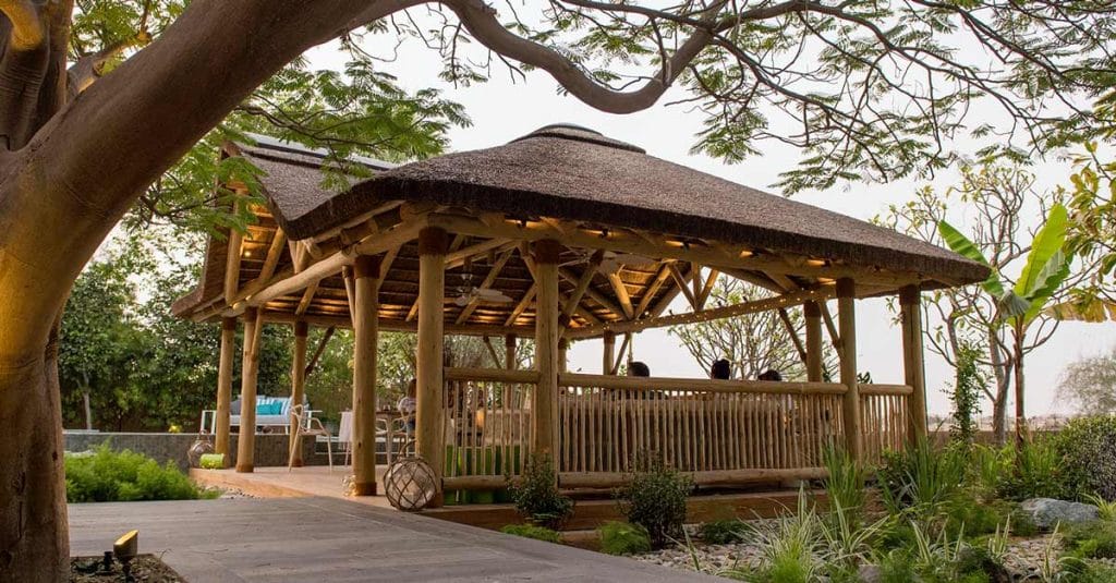 A beautiful African thatch structure with decking and balustrades