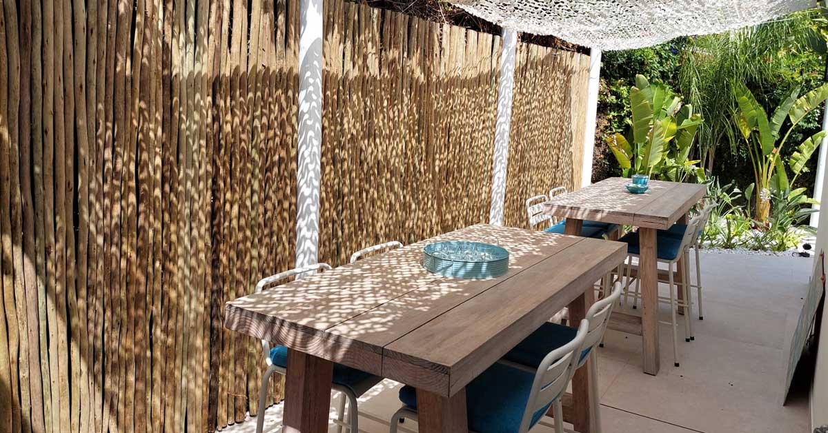Timber lath fencing with whitewash finish, showcasing rustic charm and elegance in outdoor design.