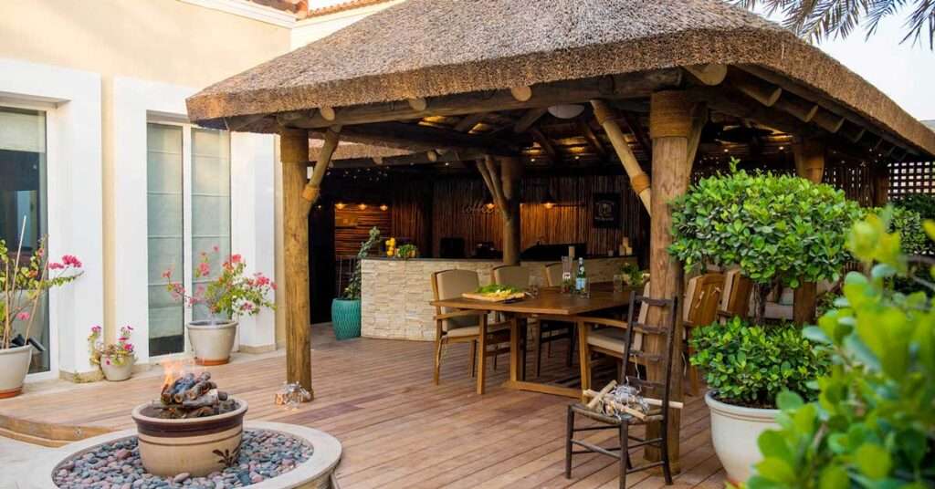 Cape Reed Thatched Gazebo with Wooden Decking and Outdoor Seating