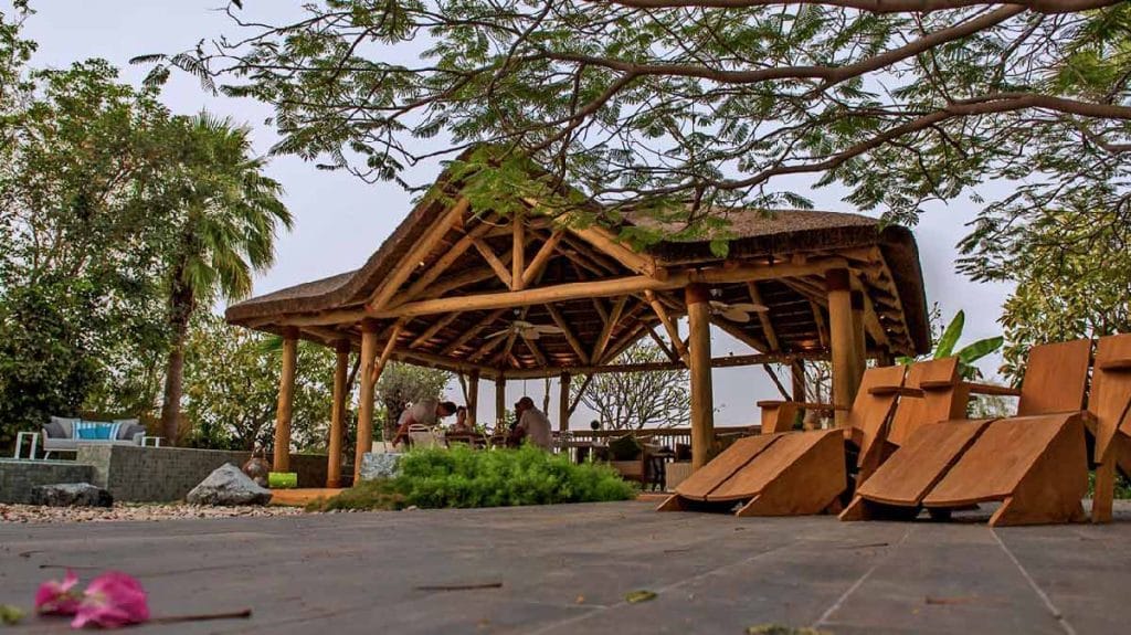 Experience Rustic Elegance: Relax in the Shade of a Cape Reed Thatched Gazebo with Timber Decking