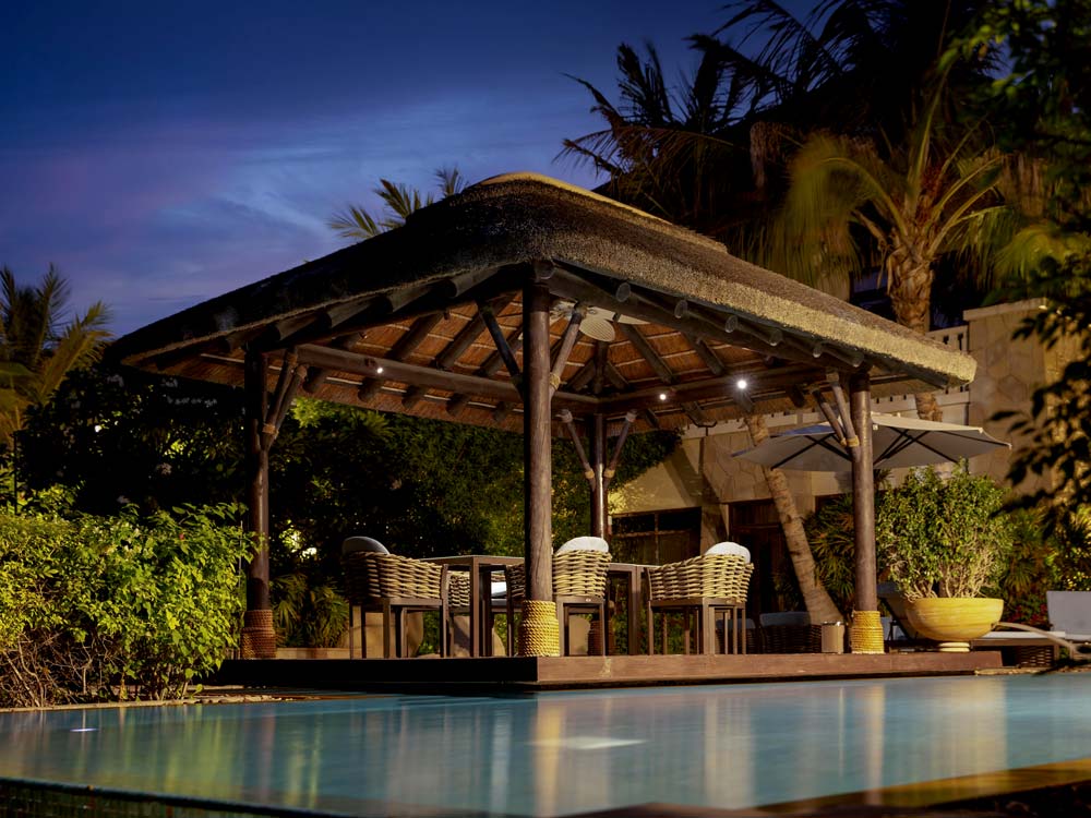 Experience rustic charm and relaxation under the Cape Reed Dominica thatched roof. Enjoy the synergy of natural textures in this outdoor seating area with timber decking.