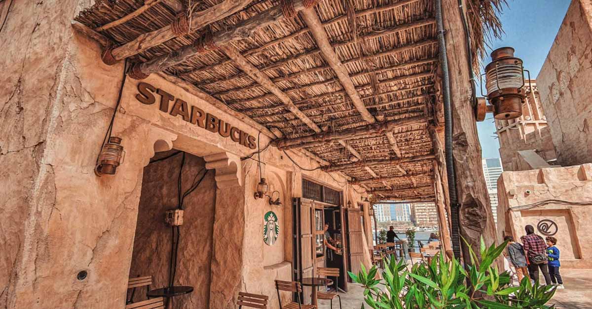 The beautiful setting of Starbucks, Al Seef with a barasti style pergola