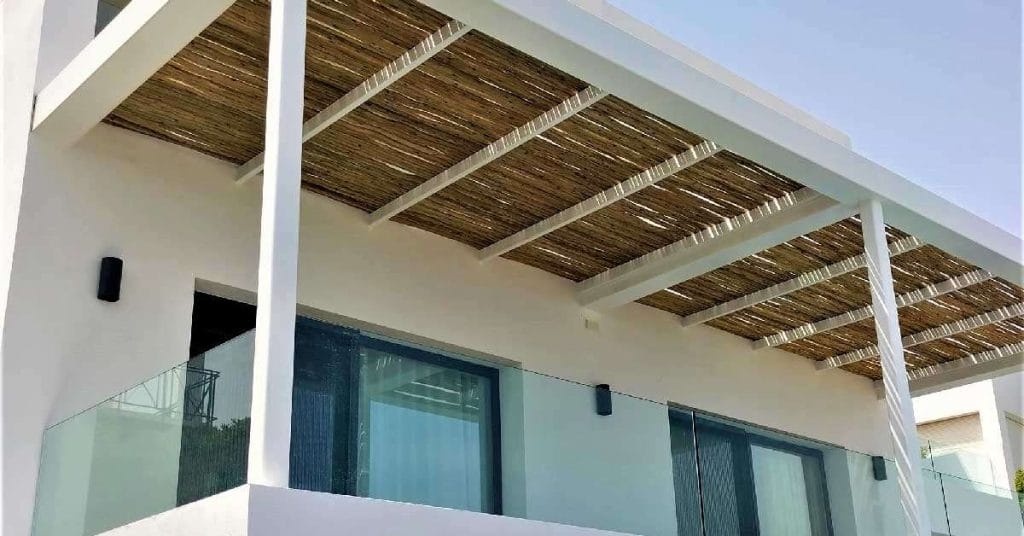 A stunning Cape Reed Wooden Whitewash Pergola.