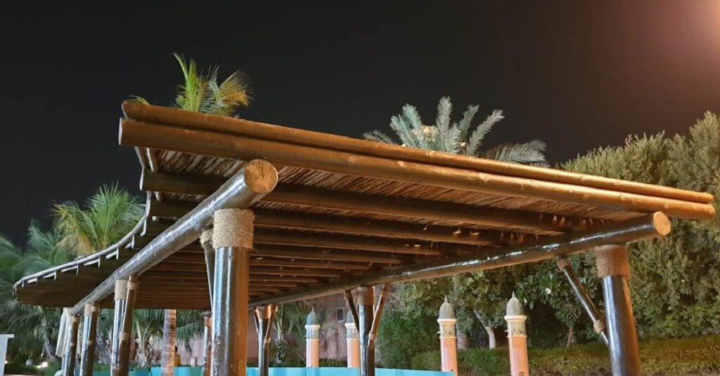Dolphin Bay’s serene lagoon area featuring Cape Reed’s wooden shading structures and timber walkways, enhancing the natural beauty of the setting.