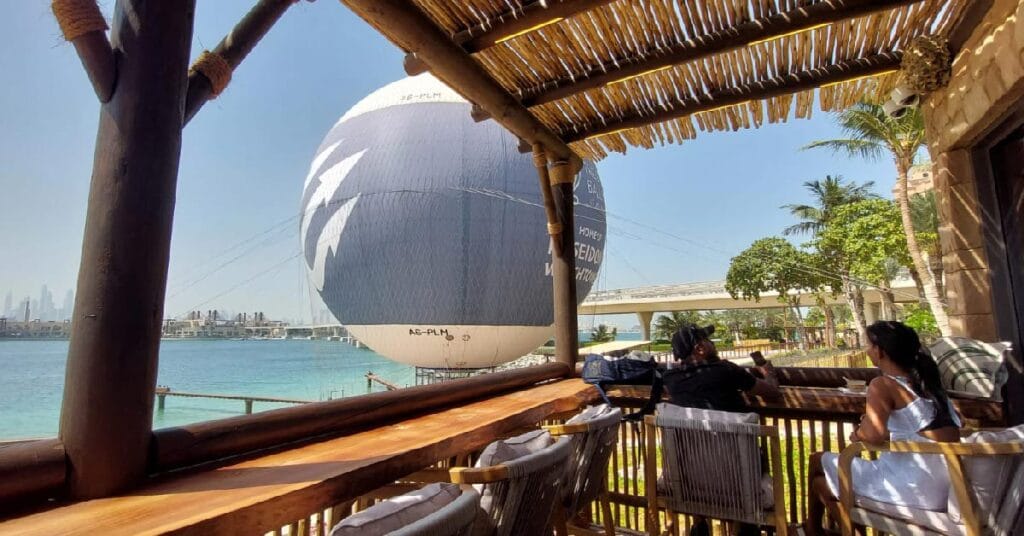The Dubai Balloon, a tethered helium balloon experience, with Cape Reed’s timber walkways and balustrades enhancing the attraction’s natural elegance.