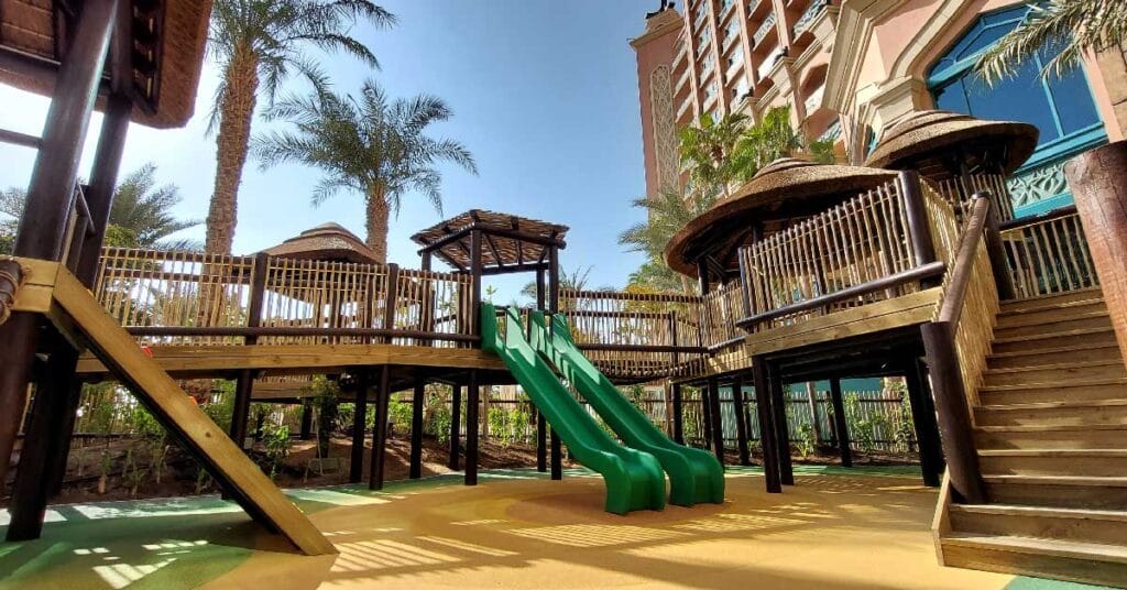 Kids' Club: Playful Timber Creations Cape Reed's craftsmanship extends to the Kids' Club, where they designed an outdoor play area with timber play structures. These eco-friendly installations encourage children to engage with nature while enjoying creative, outdoor fun. The natural materials ensure that the play structures are not only safe but also blend harmoniously with the surrounding resort environment.
