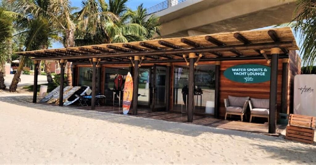 Atlantis beachfront showcasing Cape Reed timber structures, including pergolas and cladding, enhancing the natural beauty of the watersports area.