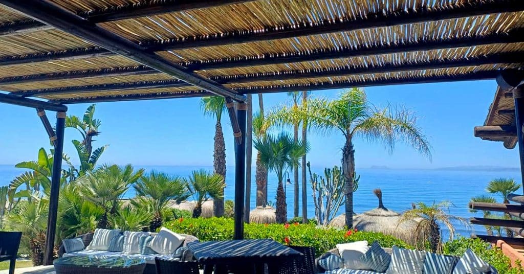 Beautiful outdoor seating area under a Cape Reed pergola to enjoy the view!