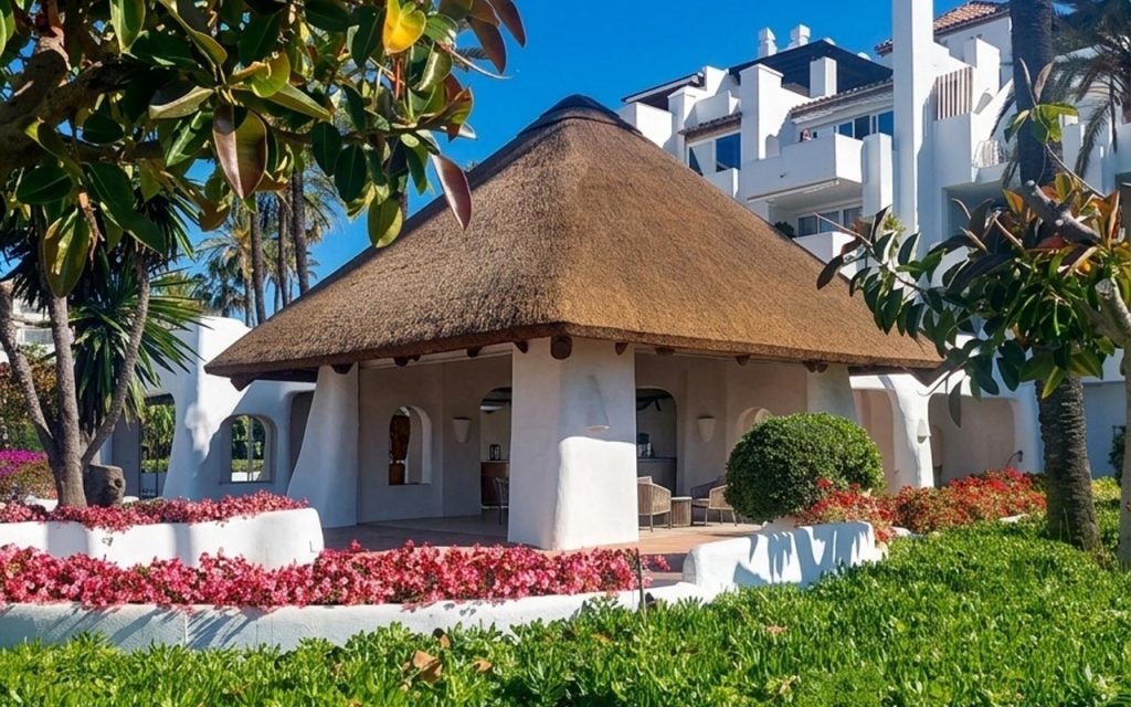 Luxury thatched roof cabanas at Alcazaba Beach Estepona after refurbishment by Cape Reed Spain