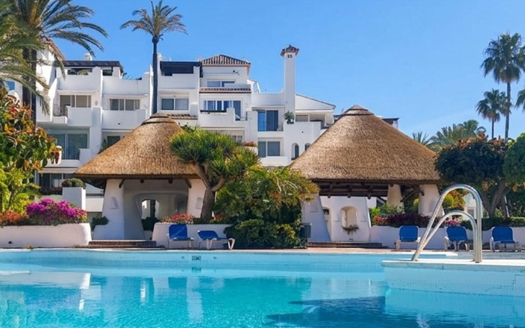 Refurbished thatched roof gazebo at Alcazaba Beach Estepona with Cape Reed thatch and tropical gardens